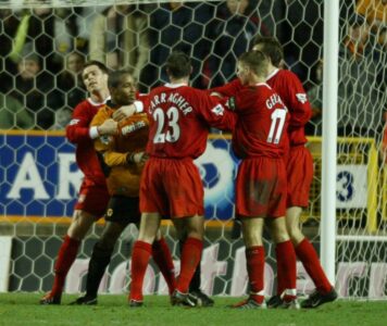 Wolverhampton Wanderers' Paul Ince clashes with Liverpool's Steven Gerrard