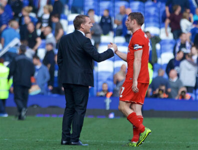 Former Liverpool manager Brendan Rodgers shakes hands with James Milner