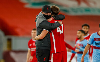 Jurgen Klopps hugs Nat Phillips