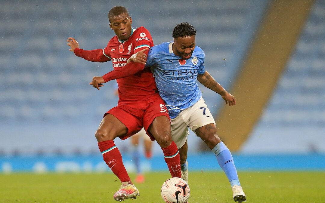 Liverpool's Georginio Wijnaldum (L) challenges Manchester City's Raheem Sterling during the FA Premier League match between Manchester City FC and Liverpool FC at the Etihad Stadium