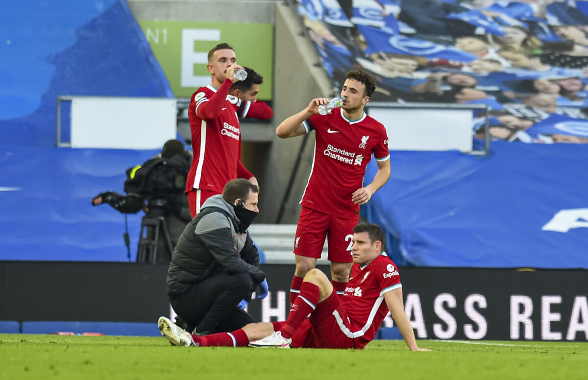 Liverpool's James Milner is treated for an injury during the FA Premier League match between Brighton & Hove Albion FC and Liverpool FC at the AMEX Stadium