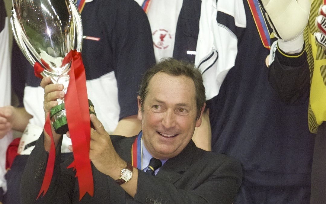 Liverpool's manager Gerard Houllier lifts the UEFA Super Cup