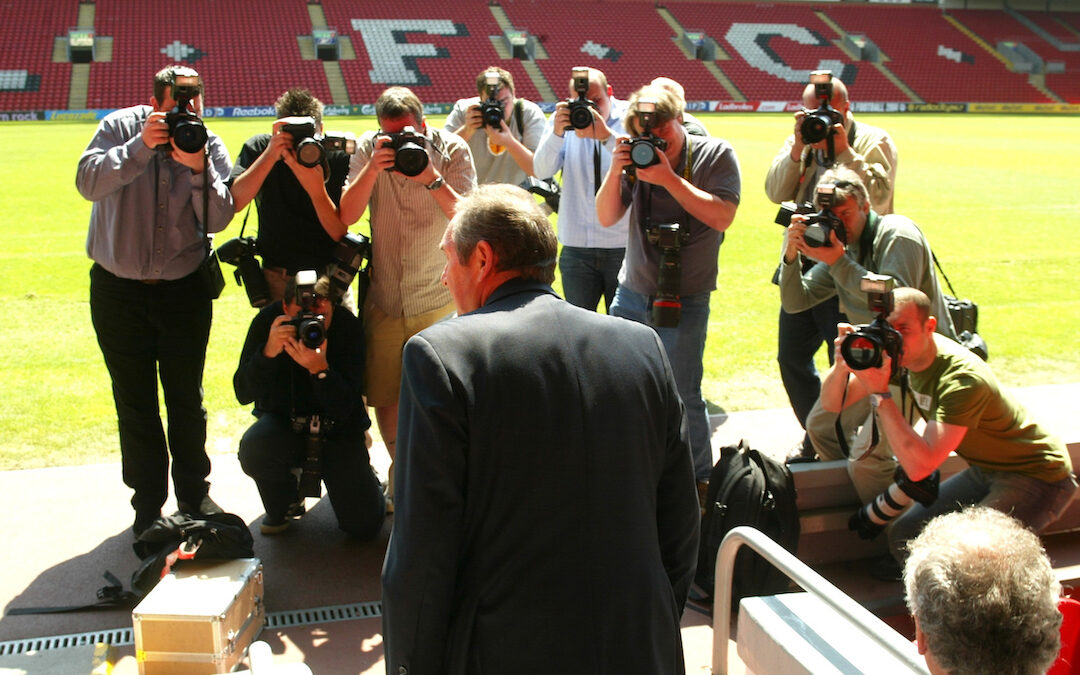 Liverpool's manager Gerard Houllier walks out to face the press