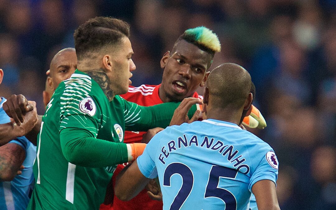 Manchester United's Paul Pogba clashes with Manchester City's Fernandinho