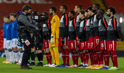 Liverpool players line up before a UEFA Champions League match at Anfield