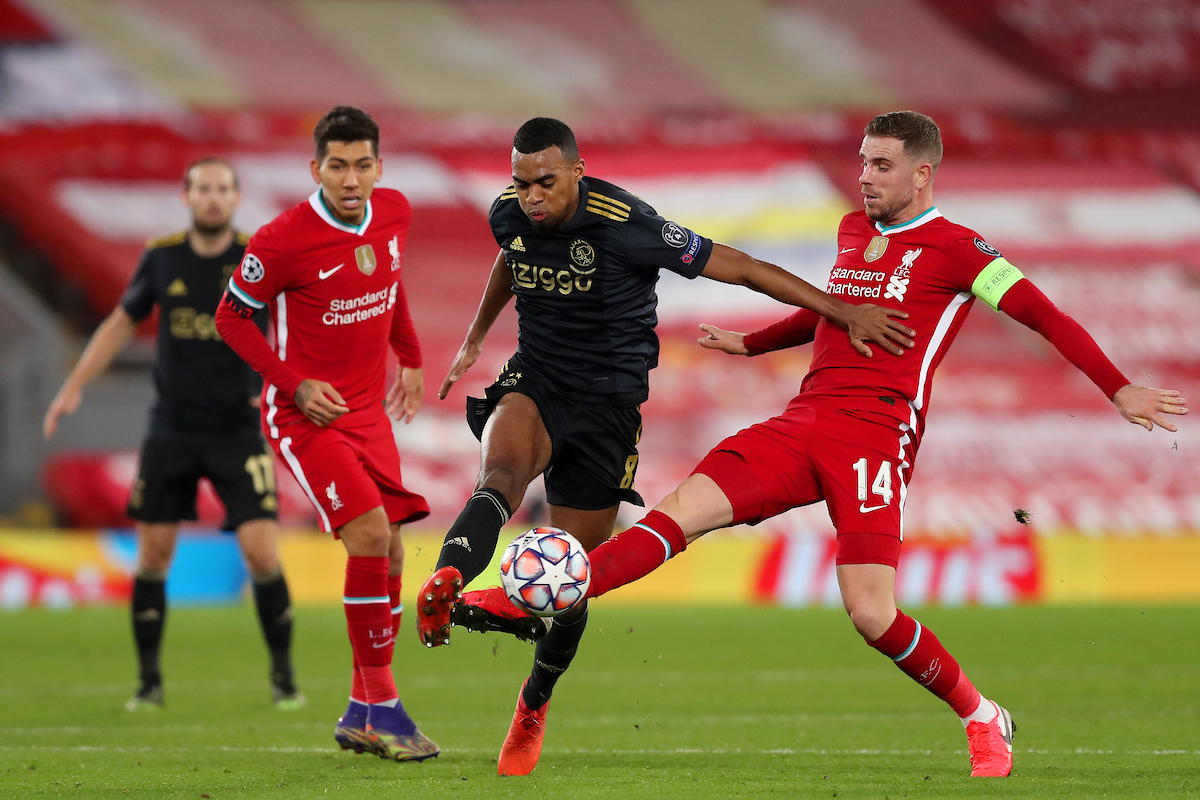 Liverpool’s captain Jordan Henderson and Ajax’s Ryan Gravenberch during the UEFA Champions League Group D match between Liverpool FC and AFC Ajax at Anfield