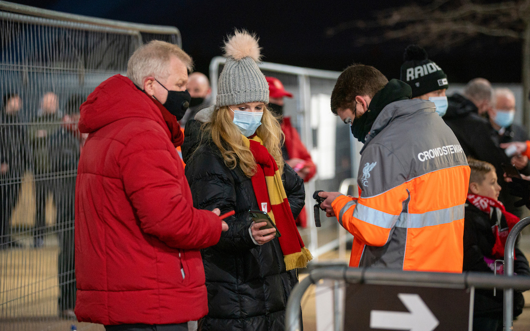 Sunday, December 6, 2020: Liverpool supporters show their electronic tickets on mobile phones as the club welcomes 2,000 spectators back into the stadium, pictured before the FA Premier League match between Liverpool FC and Wolverhampton Wanderers FC at Anfield. Liverpool won 4-0.