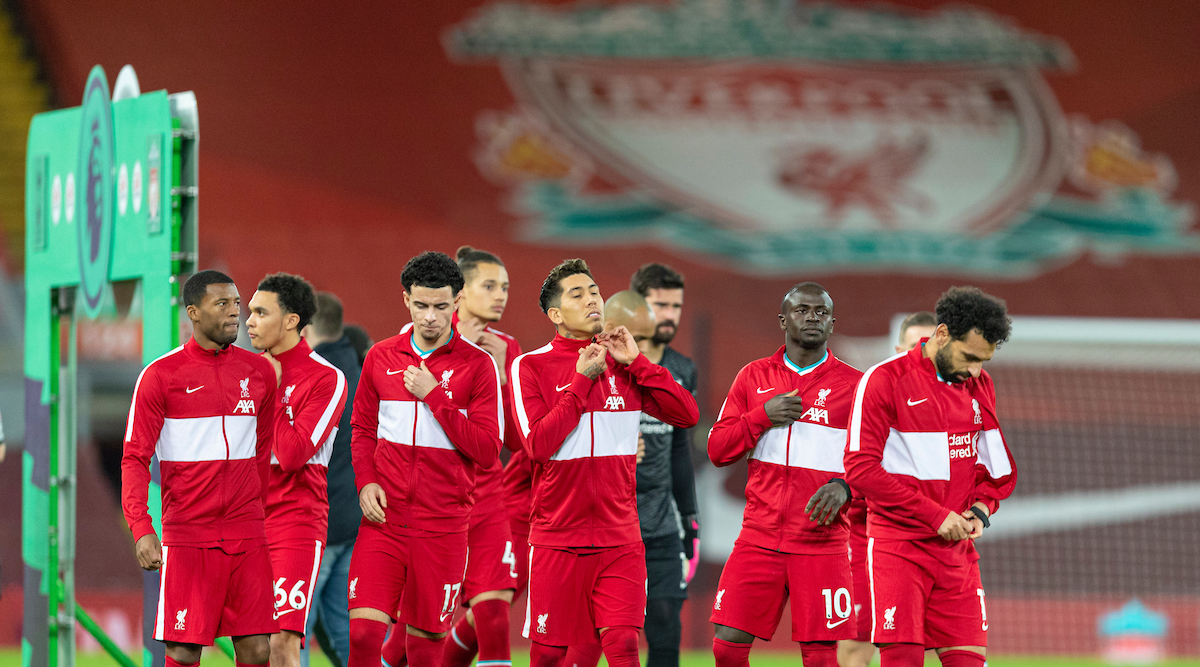 Liverpool players take off their anthem jackets before the FA Premier League match between Liverpool FC and Tottenham Hotspur FC at Anfield