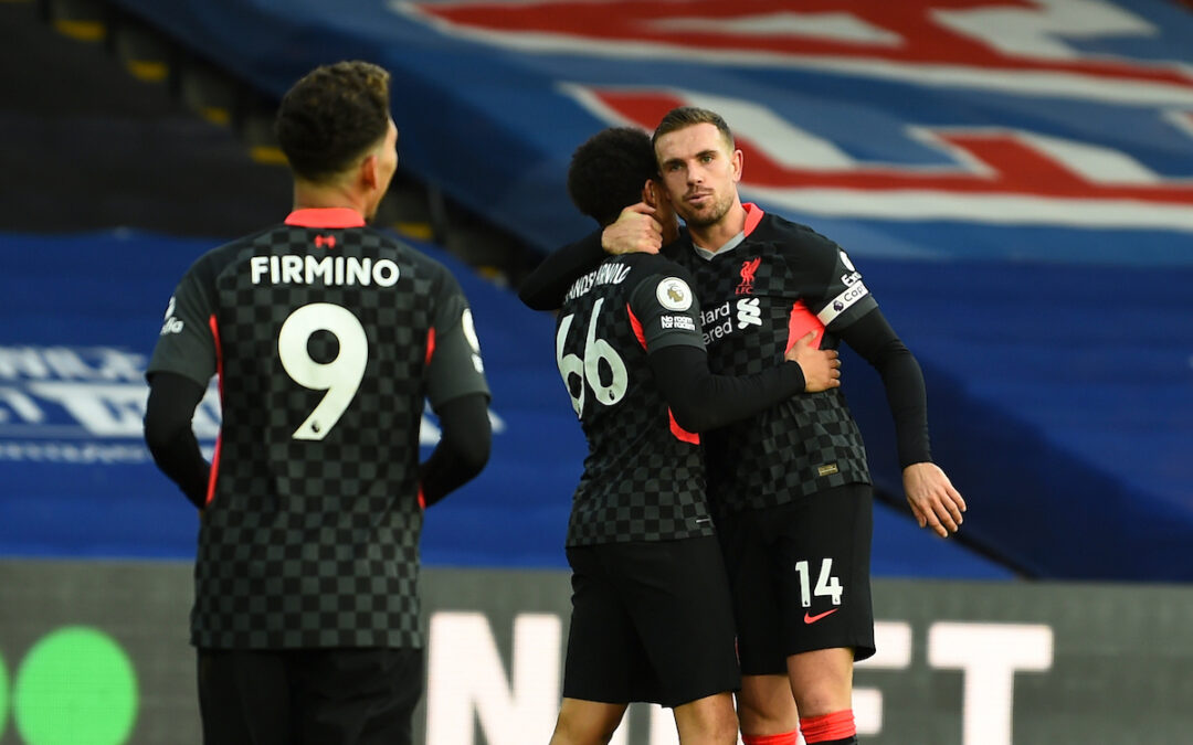 Liverpool's captain Jordan Henderson (R) celebrates with team-mate Trent Alexander-Arnold after scoring the fourth goal during the FA Premier League match between Crystal Palace FC and Liverpool FC at Selhurst Park