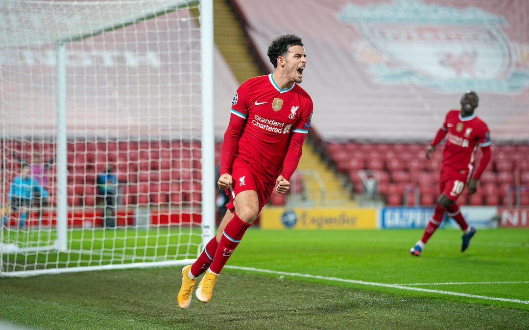 Liverpool's Curtis Jones celebrates after scoring the first goal during the UEFA Champions League Group D match between Liverpool FC and AFC Ajax at Anfield