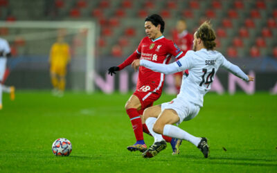 Liverpool's Takumi Minamino is challenged by FC Midtjylland's Alexander Scholz during the UEFA Champions League Group D match