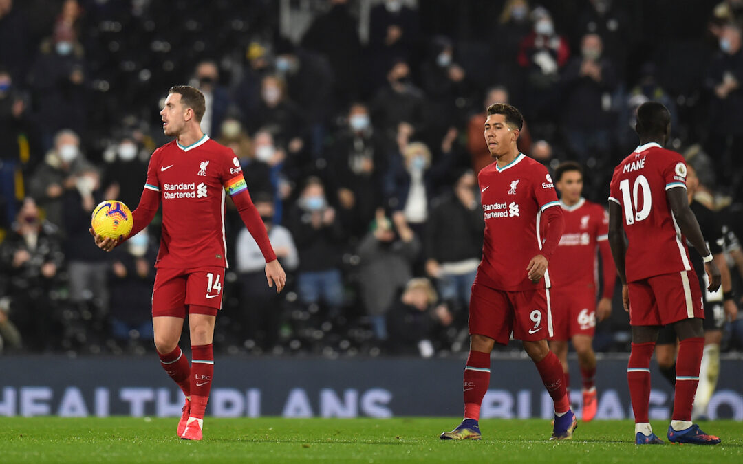 Liverpool players look dejected after Fulham