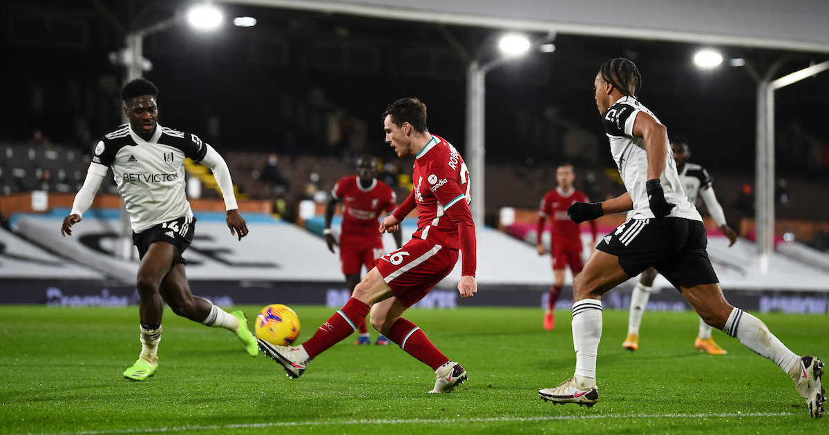 Liverpool's Andy Robertson crosses the ball under pressure from Fulham's Bobby De Cordova-Reid