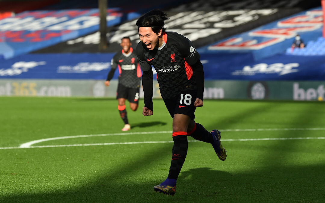 Liverpool's Takumi Minamino celebrates after scoring the first goal during the FA Premier League match between Crystal Palace FC and Liverpool FC at Selhurst Park
