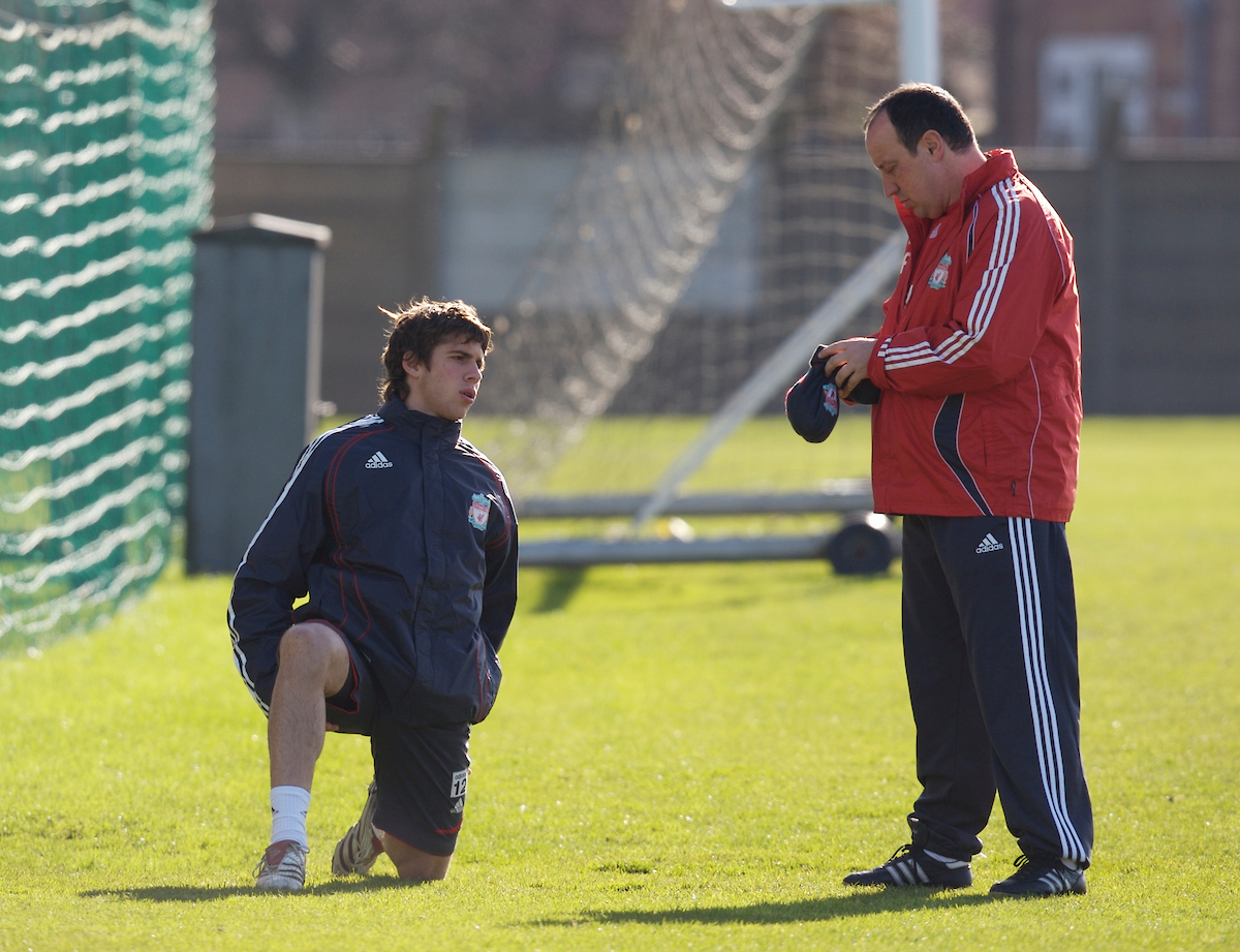 Liverpool's manager Rafael Benitez and youngster Emiliano Insua before training at Melwood ahead of the Premiership match against Manchester United