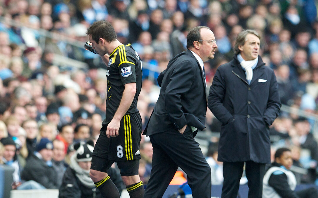 Chelsea's Frank Lampard walks off dejected past manager Rafael Benitez as he is substituted against Manchester City during the Premiership match at the City of Manchester Stadium