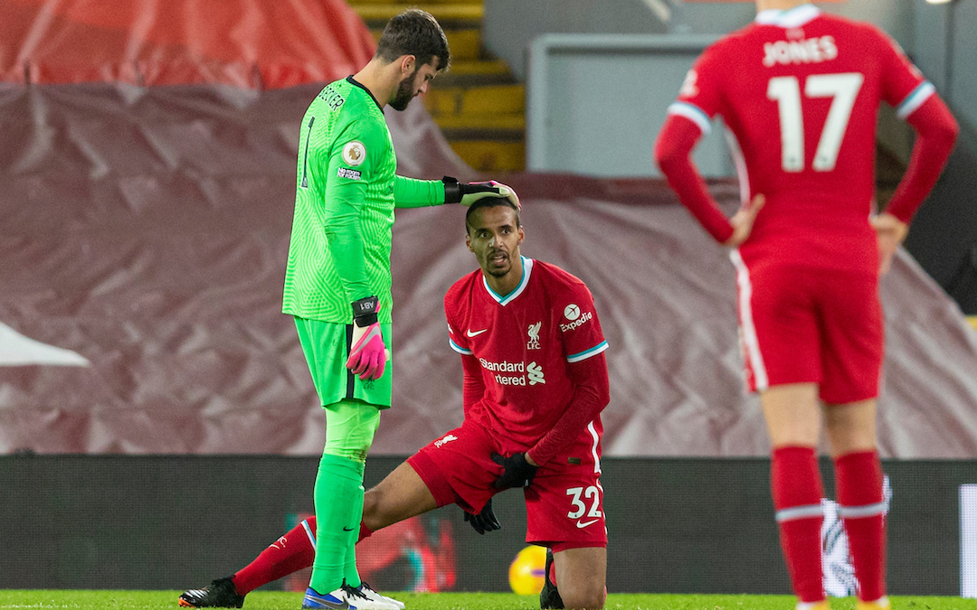 Liverpool's Joel Matip goes down with an injury during the FA Premier League match between Liverpool FC and West Bromwich Albion FC at Anfield