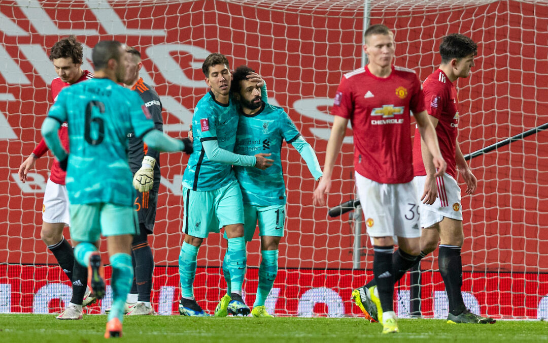 Liverpool's Mohamed Salah (R) celebrates with team-mate Roberto Firmino after scoring the second goal, to level the score 2-2, during the FA Cup 4th Round match between Manchester United FC and Liverpool FC at Old Trafford