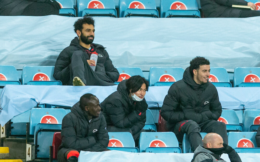 Liverpool's substituted players Sadio Mané, Mohamed Salah. Takumi Minamino anmd Curtis Jones sit in the stands during the FA Cup 3rd Round match between Aston Villa FC and Liverpool FC at Villa Park