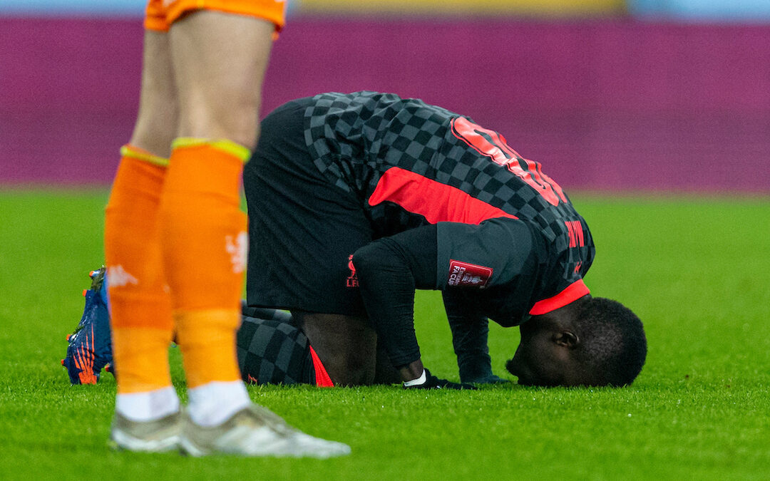 Liverpool's Sadio Mané kneels to pray as he celebrates after scoring the first goal during the FA Cup 3rd Round match between Aston Villa FC and Liverpool FC at Villa Park