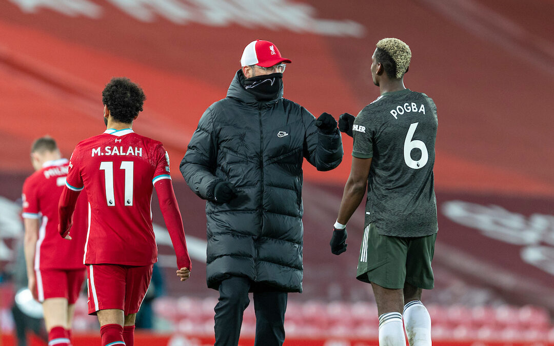 Liverpool's manager Jürgen Klopp (L) fist bumps Manchester United's Paul Pogba during the FA Premier League match between Liverpool FC and Manchester United FC at Anfield