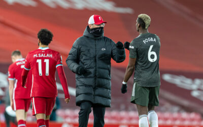 Liverpool's manager Jürgen Klopp (L) fist bumps Manchester United's Paul Pogba during the FA Premier League match between Liverpool FC and Manchester United FC at Anfield