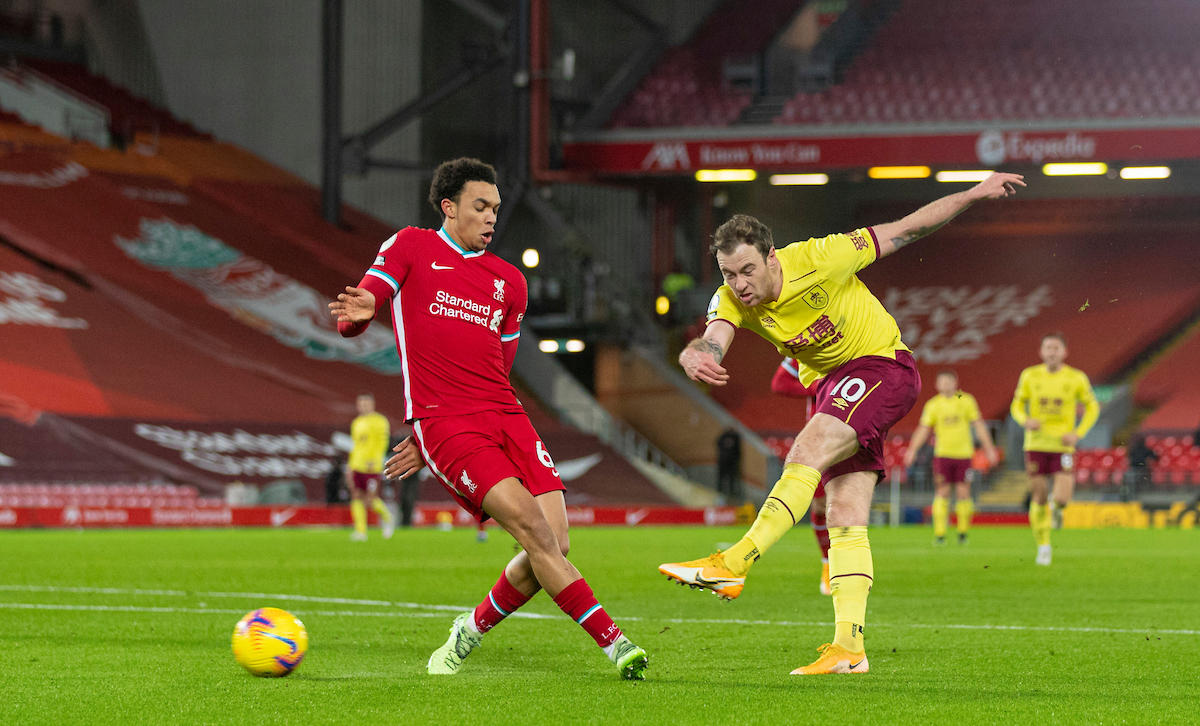 Burnley's Ashley Barnes shoots under pressure from Liverpool's Trent Alexander-Arnold during the FA Premier League match between Liverpool FC and Burnley FC at Anfield
