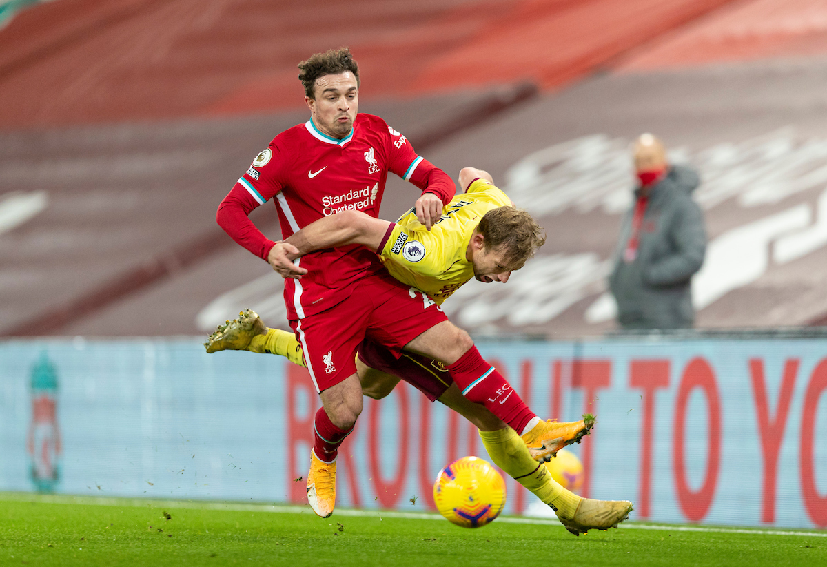 Liverpool's Xherdan Shaqiri (L) and Burnley's Charlie Taylor during the FA Premier League match between Liverpool FC and Burnley FC at Anfield