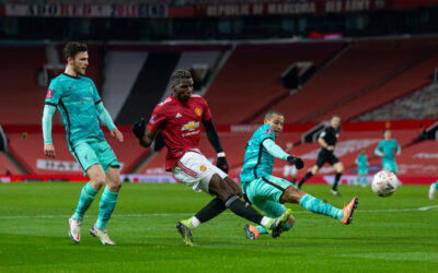 Manchester United's Paul Pogba (C) with Liverpool's Andy Robertson (L) and Thiago Alcantara (R) during the FA Cup 4th Round match between Manchester United FC and Liverpool FC at Old Trafford