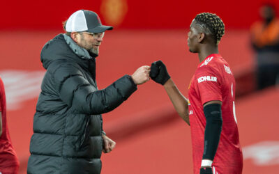 Liverpool's manager Jürgen Klopp with Manchester United's Paul Pogba after the FA Cup 4th Round match between Manchester United FC and Liverpool FC at Old Trafford