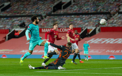 Liverpool's Mohamed Salah scores the first goal chipping the ball over Manchester United's goalkeeper Dean Henderson during the FA Cup 4th Round match between Manchester United FC and Liverpool FC at Old Trafford