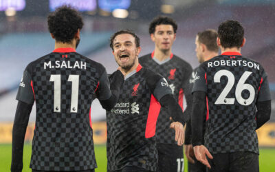 Liverpool's Mohamed Salah celebrates with team-mate captain Jordan Henderson (R) after scoring the second goal during the FA Premier League match between West Ham United FC and Liverpool FC at the London Stadium