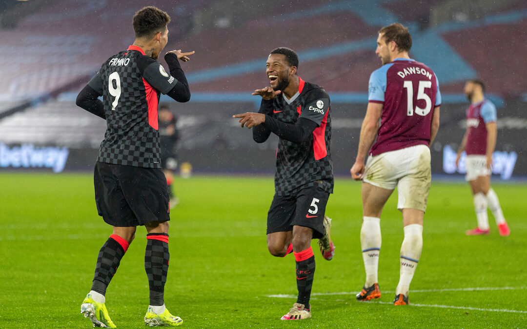 Liverpool's Georginio Wijnaldum (R) celebrates with team-mate Roberto Firmino after scoring the third goalduring the FA Premier League match between West Ham United FC and Liverpool FC at the London Stadium