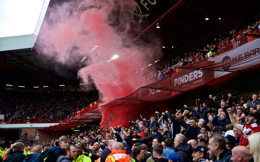 Liverpool supporters set off a red smoke bomb as they celebrate their side's winning goal during the FA Premier League match between Sheffield United FC and Liverpool FC at Bramall Lane