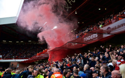 Liverpool supporters set off a red smoke bomb as they celebrate their side's winning goal during the FA Premier League match between Sheffield United FC and Liverpool FC at Bramall Lane