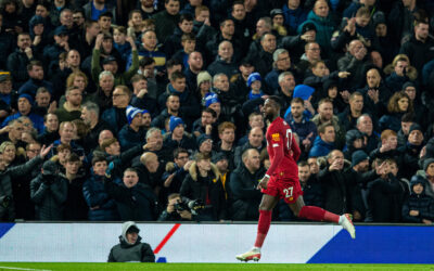 Liverpool's Divock Origi celebrates scoring the third goal, his second of the game, as Everton supporters look dejected during the FA Premier League match between Liverpool FC and Everton FC, the 234th Merseyside Derby, at Anfield