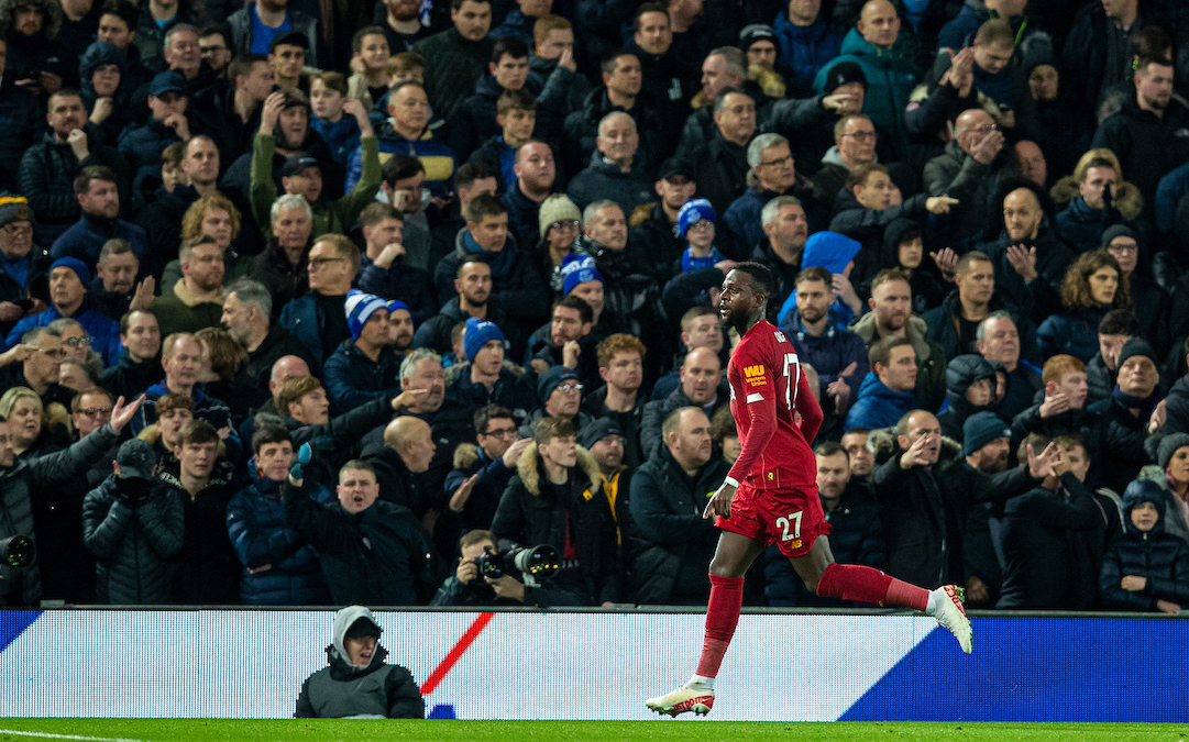 Liverpool's Divock Origi celebrates scoring the third goal, his second of the game, as Everton supporters look dejected during the FA Premier League match between Liverpool FC and Everton FC, the 234th Merseyside Derby, at Anfield