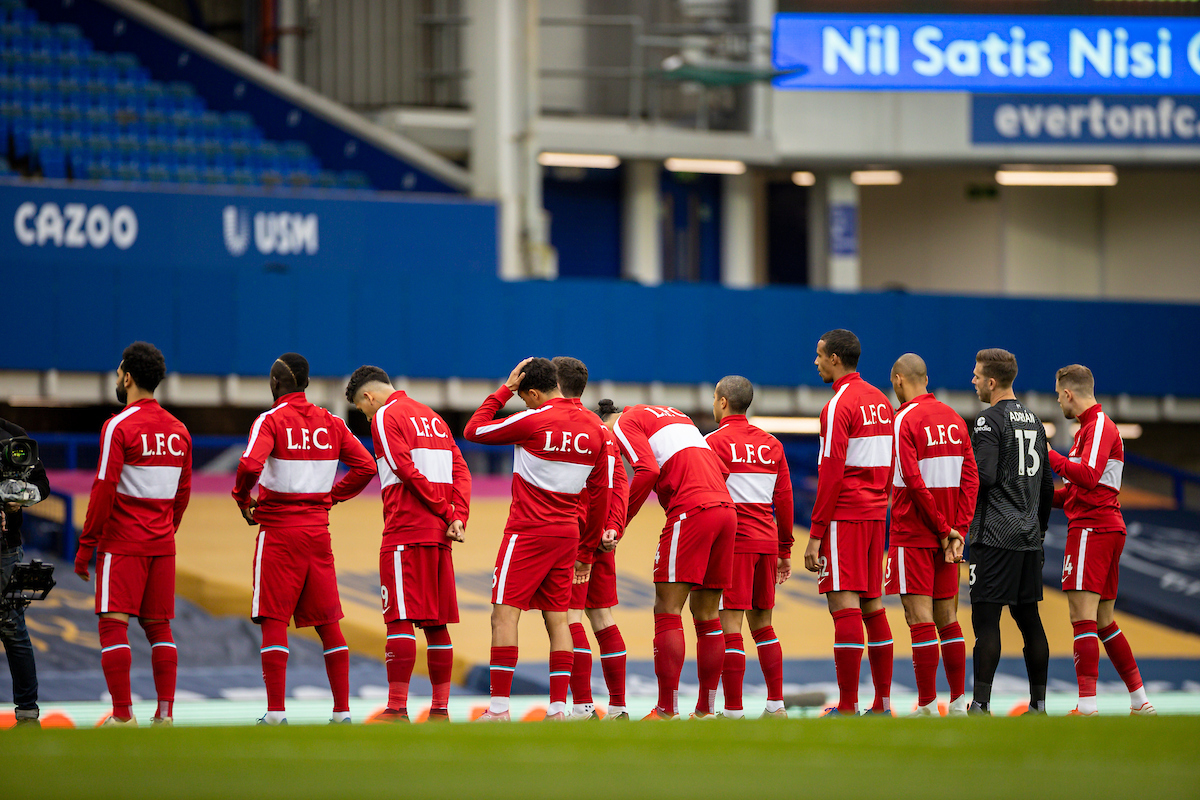 Liverpool players wearing warm-up jackets line-up before the FA Premier League match between Everton FC and Liverpool FC, the 237th Merseyside Derby, at Goodison Park