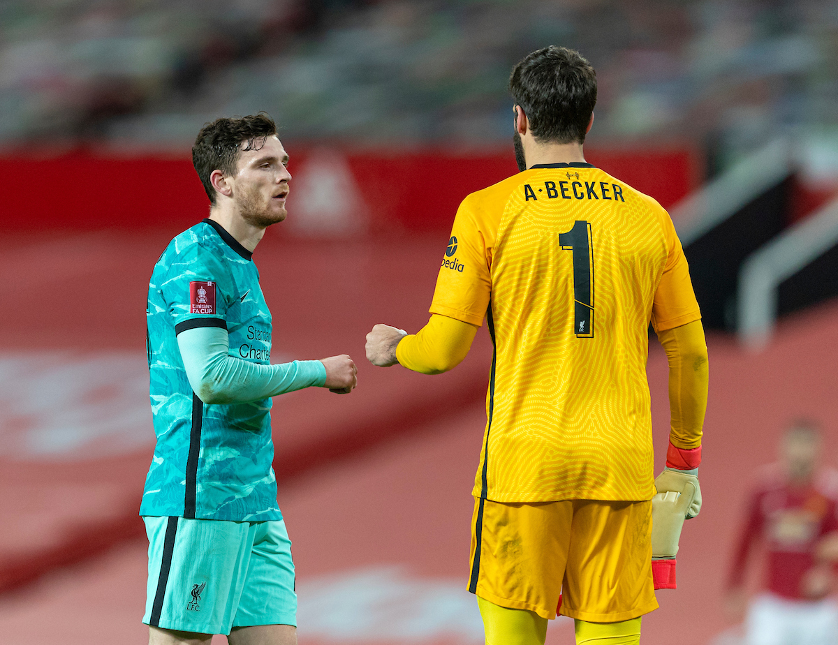 Liverpool's Andy Robertson (L) and goalkeeper Alisson Becker after the FA Cup 4th Round match between Manchester United FC and Liverpool FC at Old Trafford