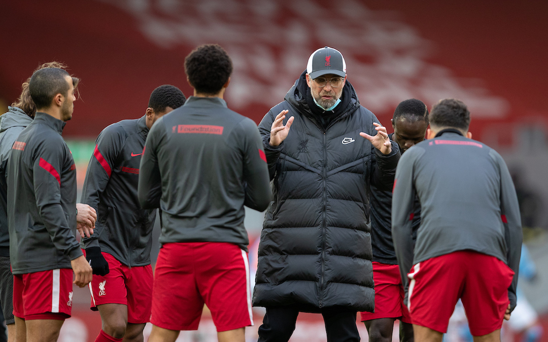 Liverpool's manager Jürgen Klopp speaks to his players during the pre-match warm-up before the FA Premier League match between Liverpool FC and Manchester City FC at Anfield