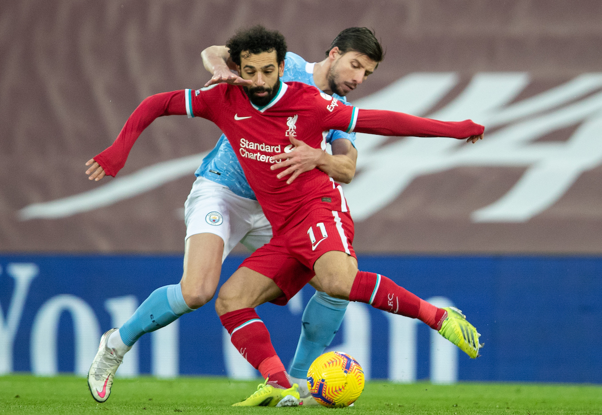 Liverpool's Mohamed Salah (L) and Manchester City's Rúben Dias during the FA Premier League match between Liverpool FC and Manchester City FC at Anfield