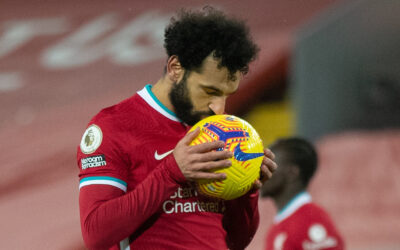 Liverpool's Mohamed Salah kisses the ball before scoring the first equalising goal from a penalty kick during the FA Premier League match between Liverpool FC and Manchester City FC at Anfield