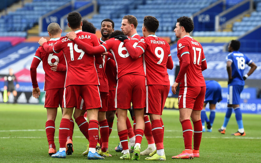 Liverpool's Mohamed Salah (hidden) celebrates with team-mates after scoring the first goal during the FA Premier League match between Leicester City FC and Liverpool FC at the King Power Stadium