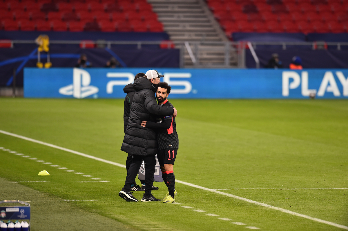 Liverpool's Mohamed Salah is embraced by manager Jürgen Klopp as he is substituted during the UEFA Champions League Round of 16 1st Leg game between RB Leipzig and Liverpool FC at the Puskás Aréna
