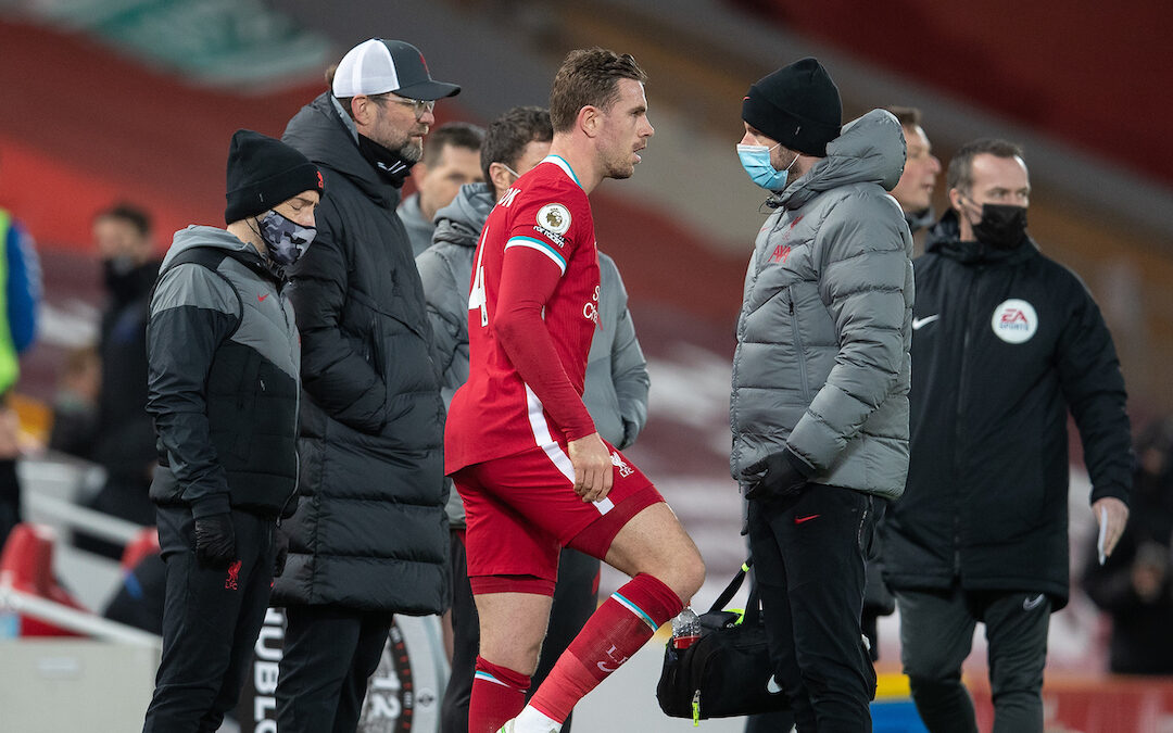 Liverpool's captain Jordan Henderson walks off injured during the FA Premier League match between Liverpool FC and Everton FC, the 238th Merseyside Derby, at Anfield