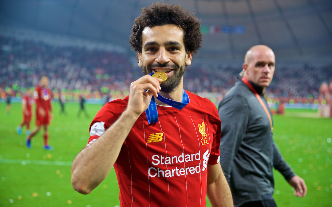 Liverpool's Mohamed Salah bites his winners' medal after the FIFA Club World Cup Qatar 2019 Final match between CR Flamengo and Liverpool FC at the Khalifa Stadium