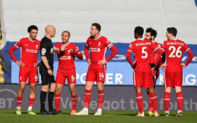 Liverpool's Trent Alexander-Arnold, Thiago Alcantara and captain Jordan Henderson speak with referee Anthony Taylor during a VAR decision for a penalty during the FA Premier League match between Leicester City FC and Liverpool FC at the King Power Stadium