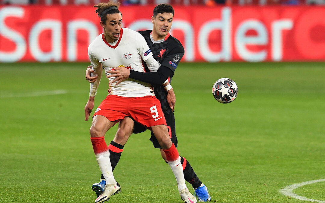 Liverpool's Ozan Kabak (R) and RB Leipzig's Yussuf Poulsen during the UEFA Champions League Round of 16 1st Leg game between RB Leipzig and Liverpool FC at the Puskás Aréna