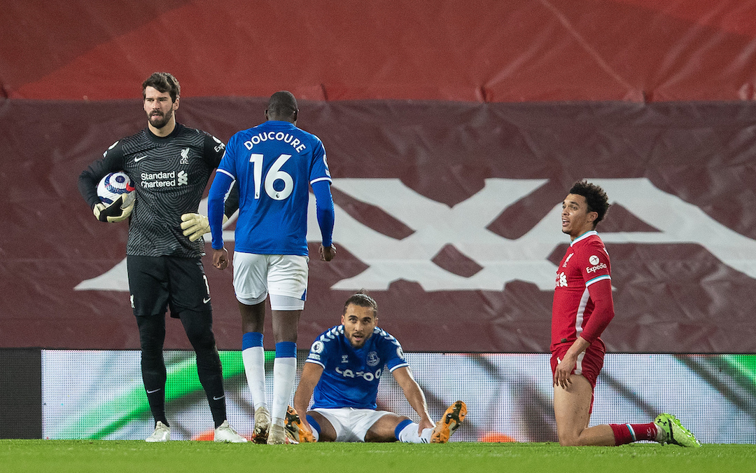 Liverpool's goalkeeper Alisson Becker looks dejected as Everton's Dominic Calvert-Lewin wins a penalty during the FA Premier League match between Liverpool FC and Everton FC, the 238th Merseyside Derby, at Anfield