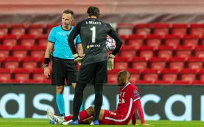 Liverpool v Chelsea: The Team Talk - Fabio Henrique Tavares 'Fabinho' goes down injured as goalkeeper Alisson Becker looks on